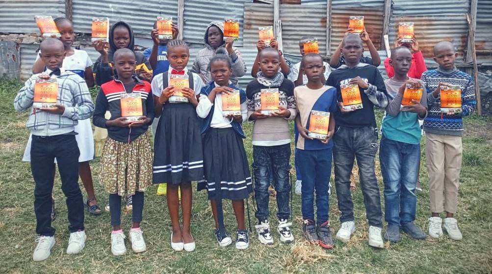 Youth holding Bibles